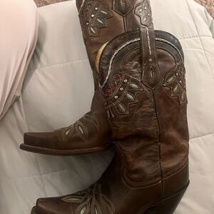 Tony Lama brown boots with turquoise and red details,